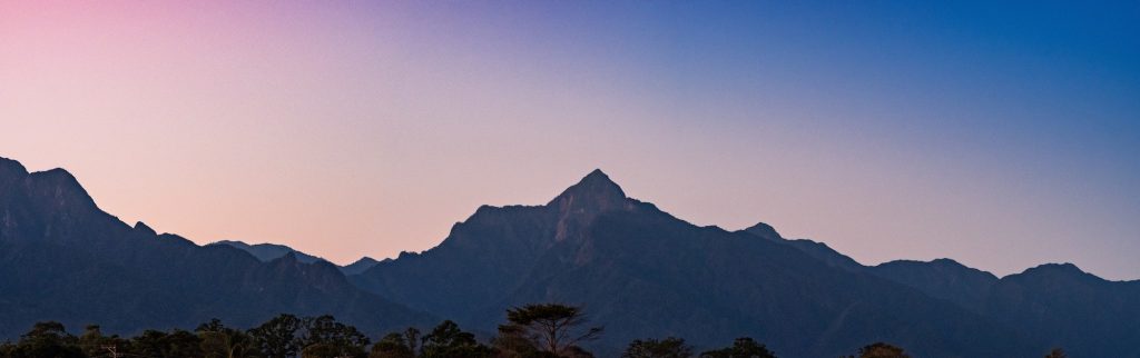 Beautiful shot of a steep mountain with a clear sky in the background