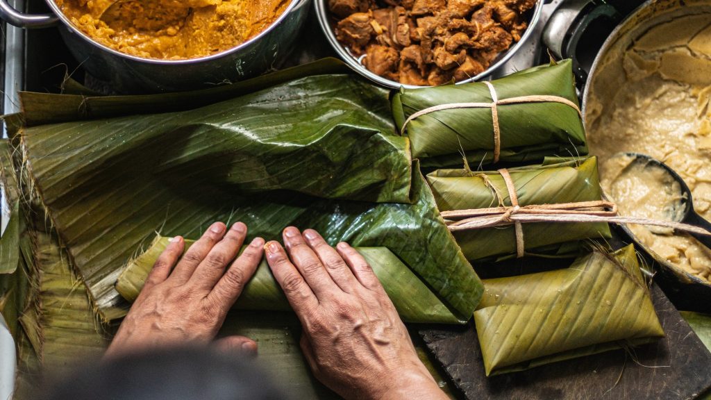 Overhead shot of person preparing honduran tamales